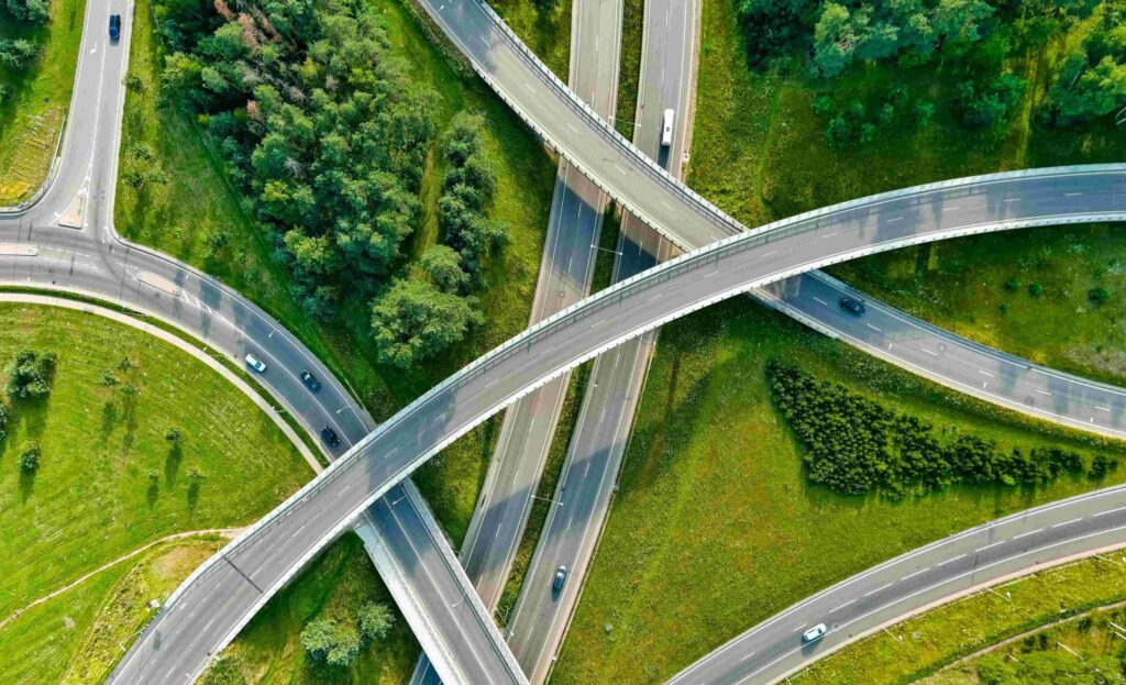 roads on a green background leading in different directions related to Corporate Sustainability Reporting Directive (CSRD) requirements