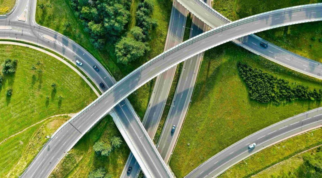 roads on a green background leading in different directions related to Corporate Sustainability Reporting Directive (CSRD) requirements